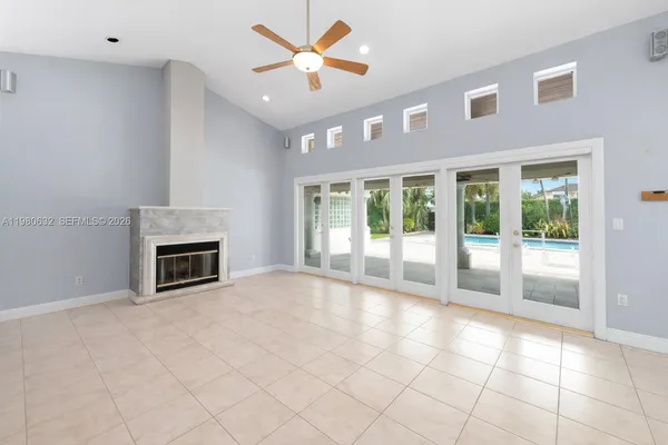 a dining room with stainless steel appliances kitchen island granite countertop a table and chairs