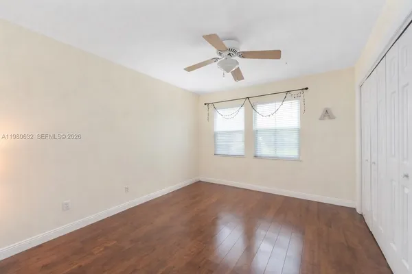 a front view of house with yard and swimming pool