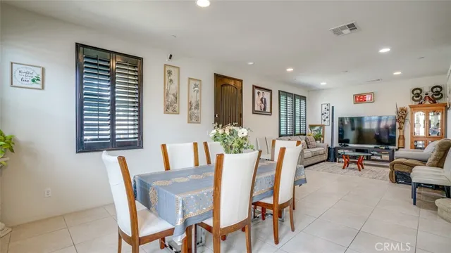 a view of a dining room with furniture and window