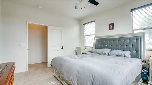 a bathroom with a granite countertop sink two mirror and a