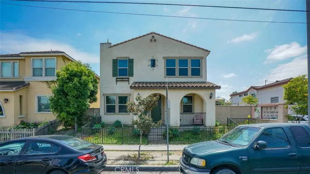 a front view of a house with parking space