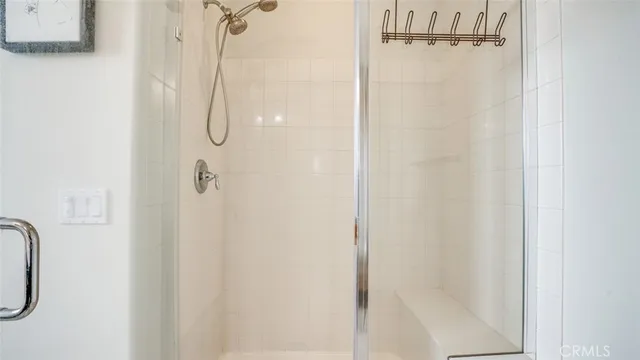 a bath room with a bed and a window