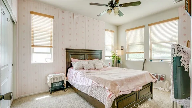 a bedroom with a bed and a couch