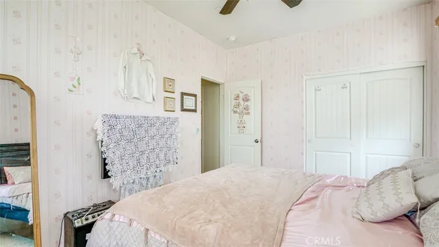 a bedroom with a bed and window