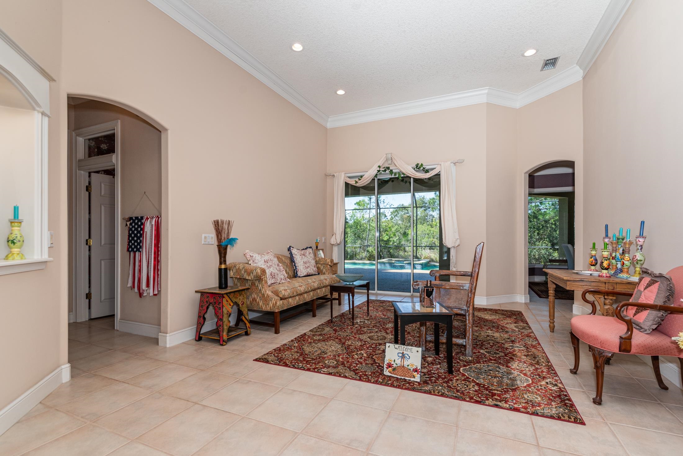 239 Marshside Drive St. Augustine, FL 32080 - Photo 14 of 57 a living room with furniture and a potted plant