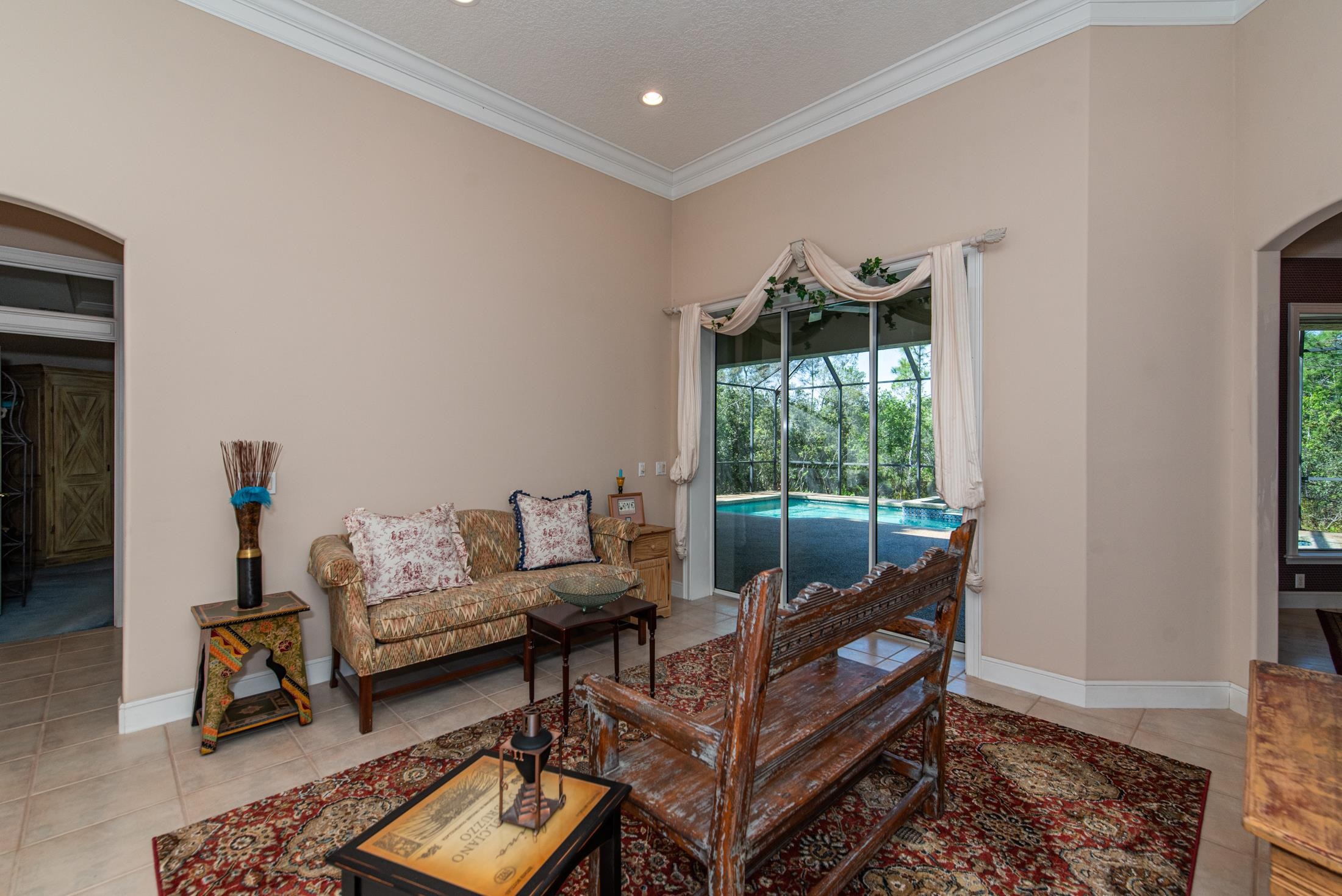 239 Marshside Drive St. Augustine, FL 32080 - Photo 15 of 57 a living room with furniture and a gate