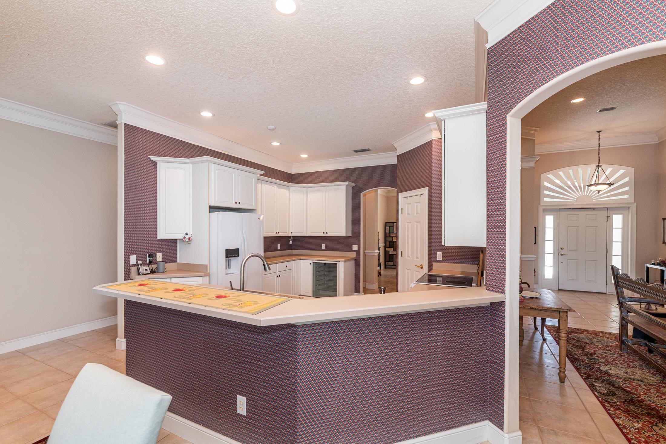 239 Marshside Drive St. Augustine, FL 32080 - Photo 16 of 57 a kitchen with stainless steel appliances a sink stove and refrigerator