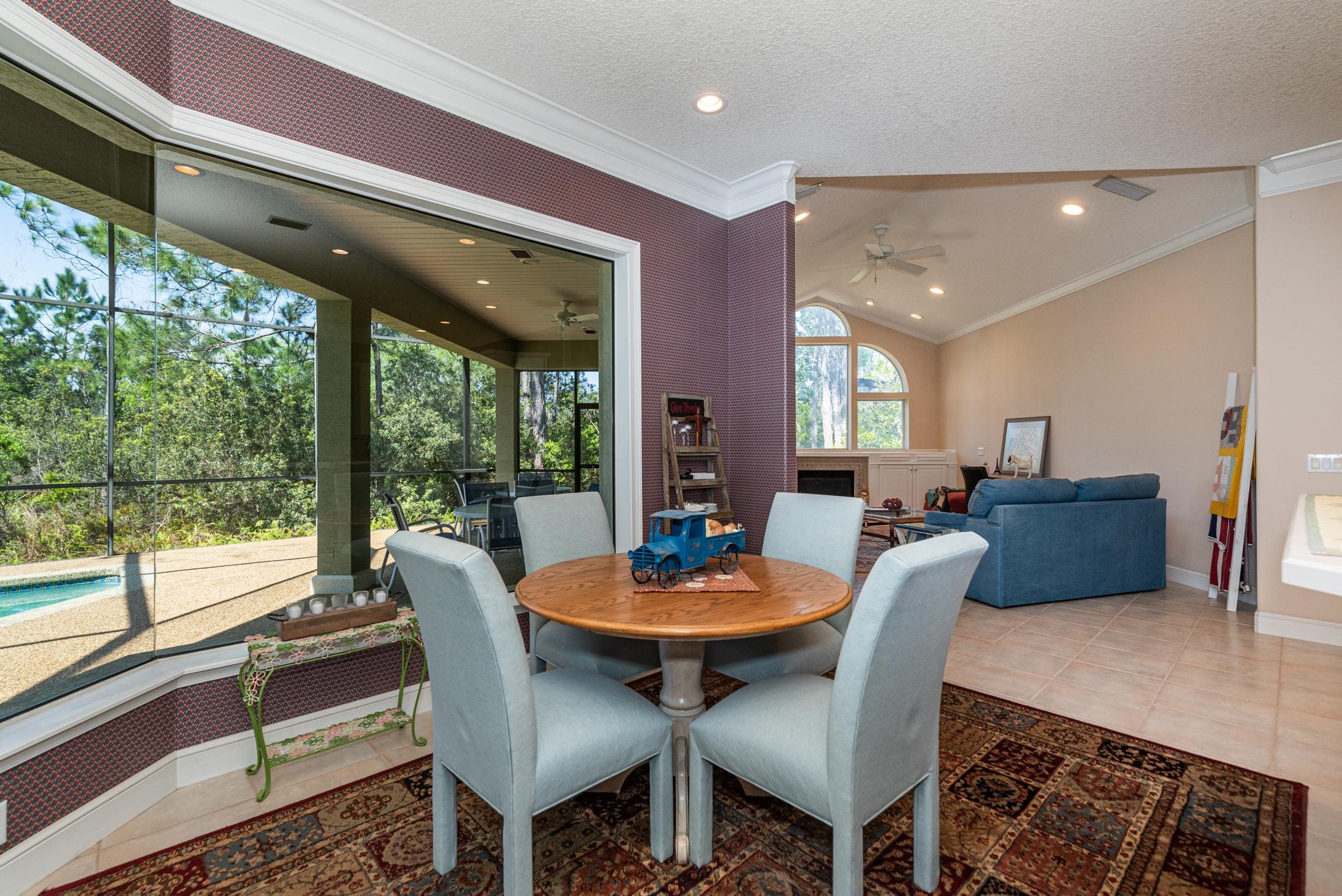 239 Marshside Drive St. Augustine, FL 32080 - Photo 22 of 57 a view of a dining room with furniture window and outside view