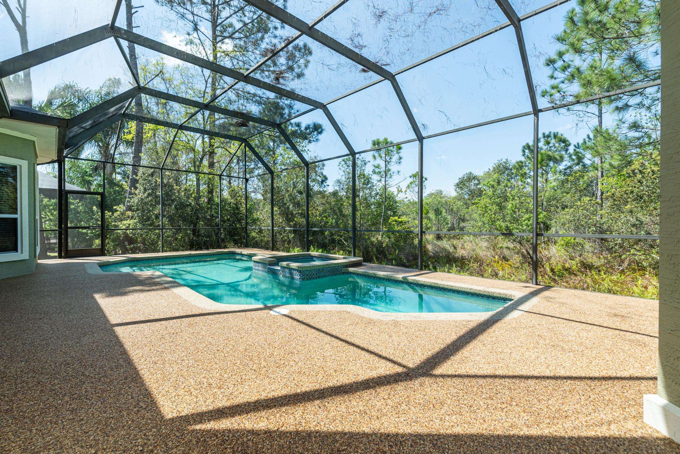 239 Marshside Drive St. Augustine, FL 32080 - Photo 31 of 57 a view of a tennis court with a small yard