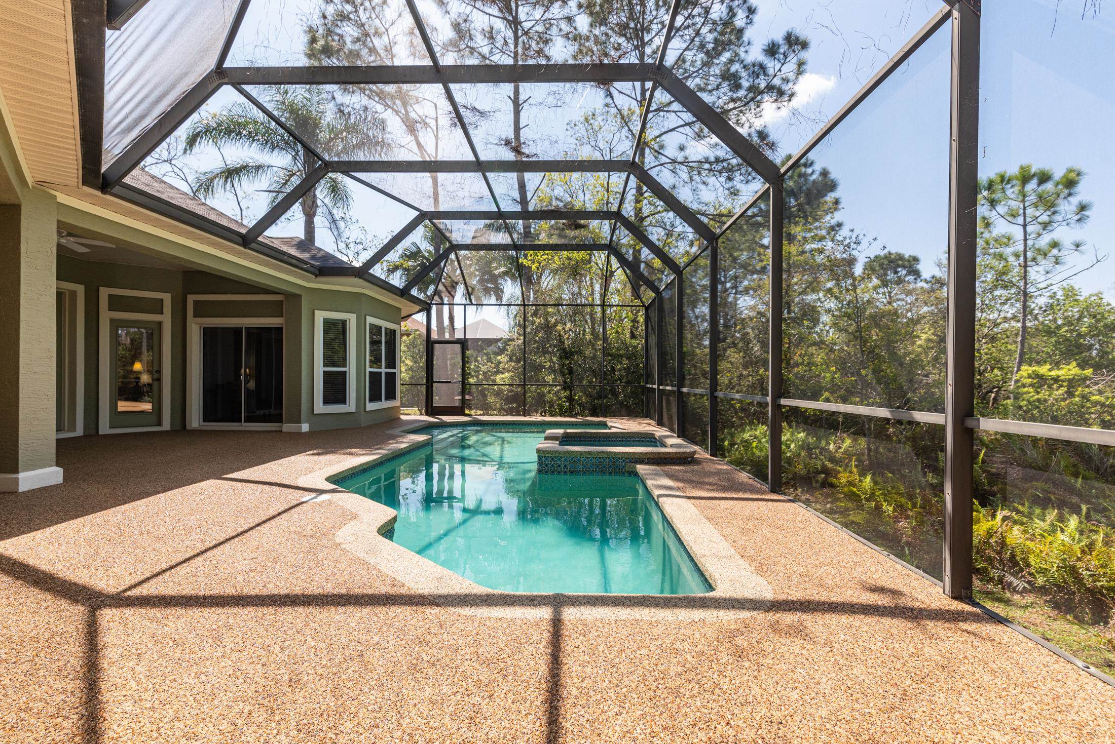 239 Marshside Drive St. Augustine, FL 32080 - Photo 32 of 57 a view of a swimming pool with a patio