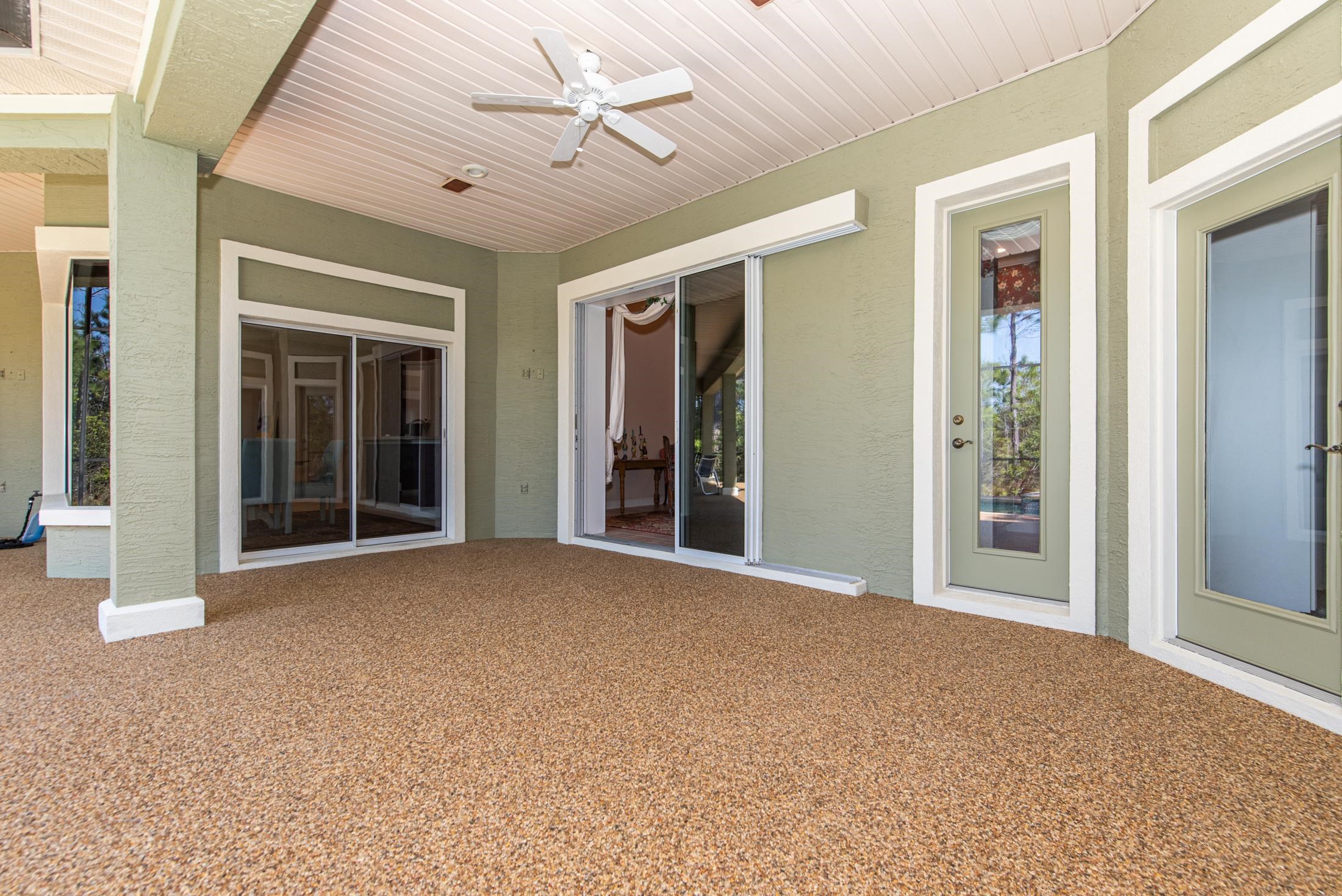 239 Marshside Drive St. Augustine, FL 32080 - Photo 37 of 57 a view of a big room with windows and chandelier fan