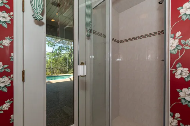 a bathroom with a double vanity sink a mirror and a bathtub