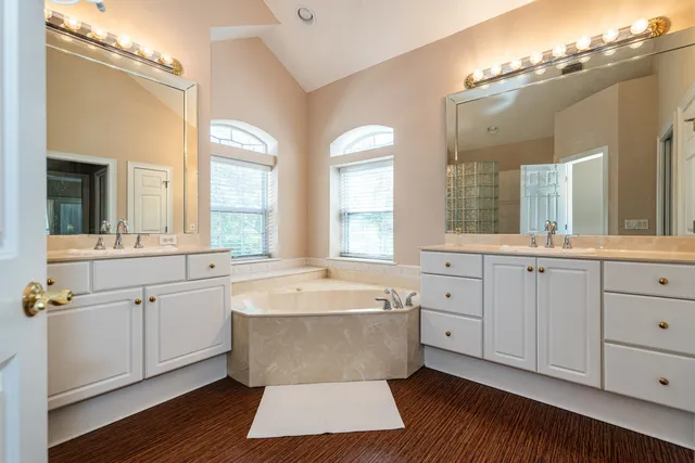 a bathroom with a sink and mirror