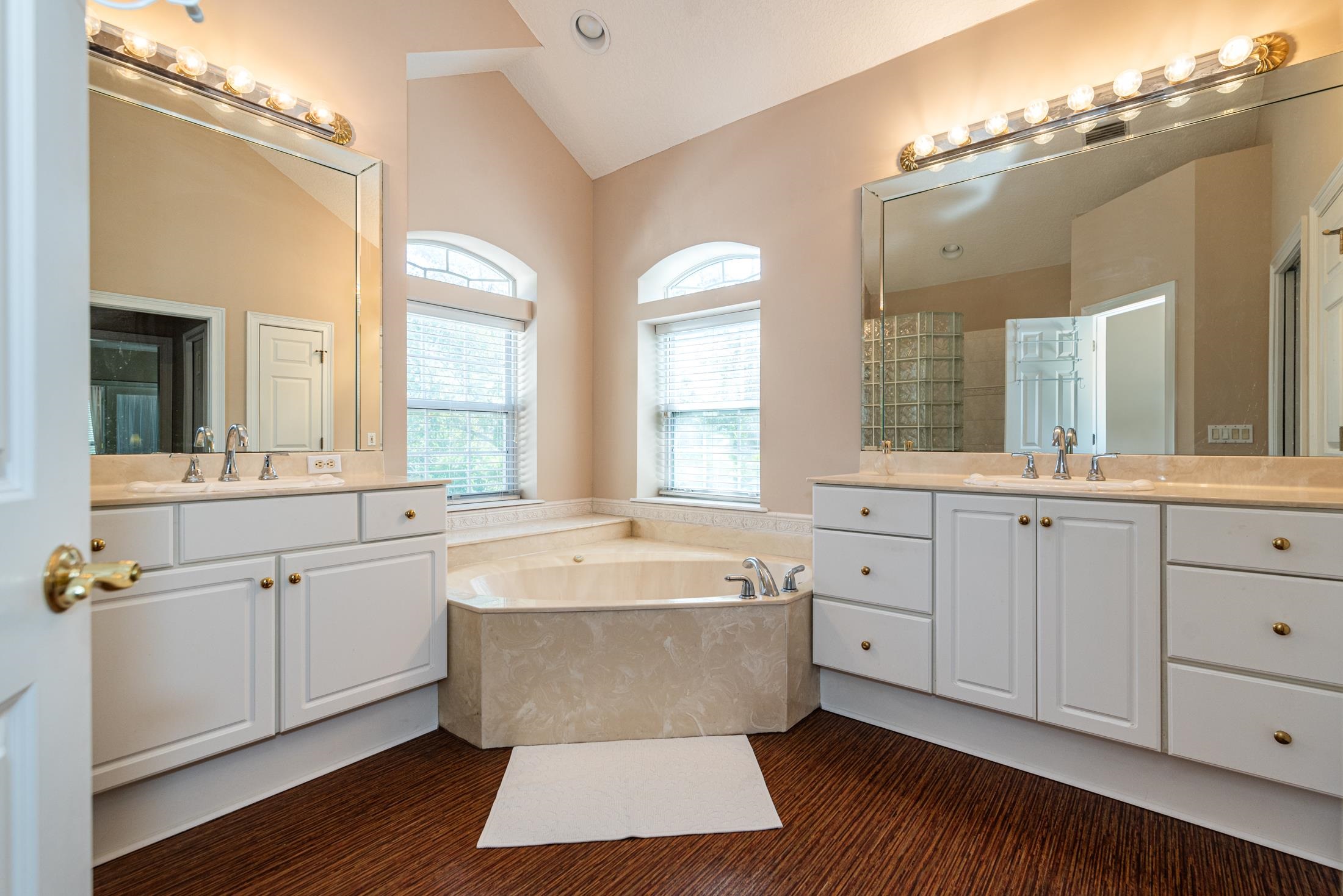 239 Marshside Drive St. Augustine, FL 32080 - Photo 46 of 57 a spacious en suite bathroom with a large tub sink and mirror