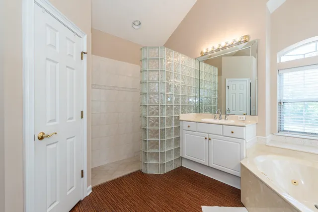 a white toilet sitting next to a bath tub