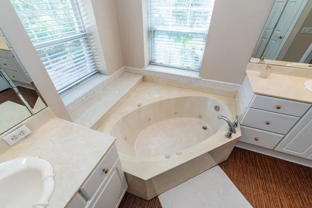 a bathroom with a sink and a large mirror