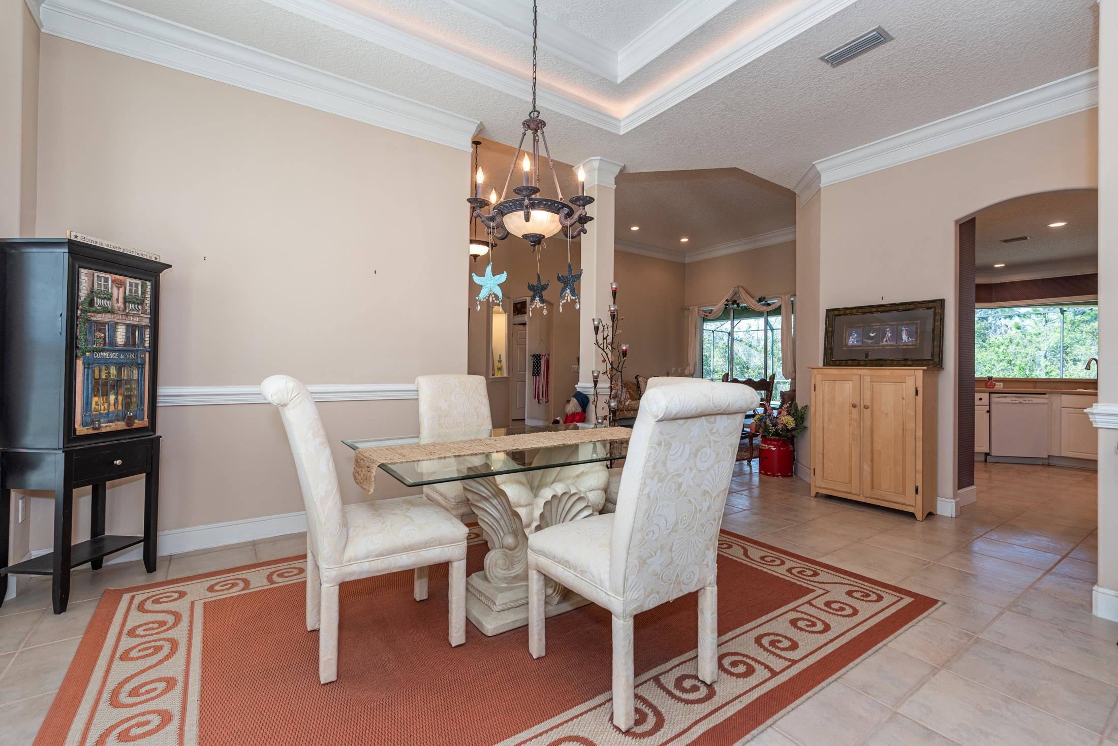 239 Marshside Drive St. Augustine, FL 32080 - Photo 10 of 57 a view of a dining room with furniture and wooden floor