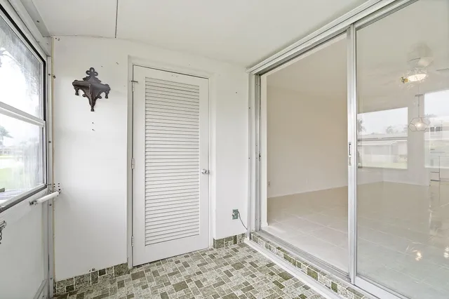 a view of a bathroom with a shower and a sink