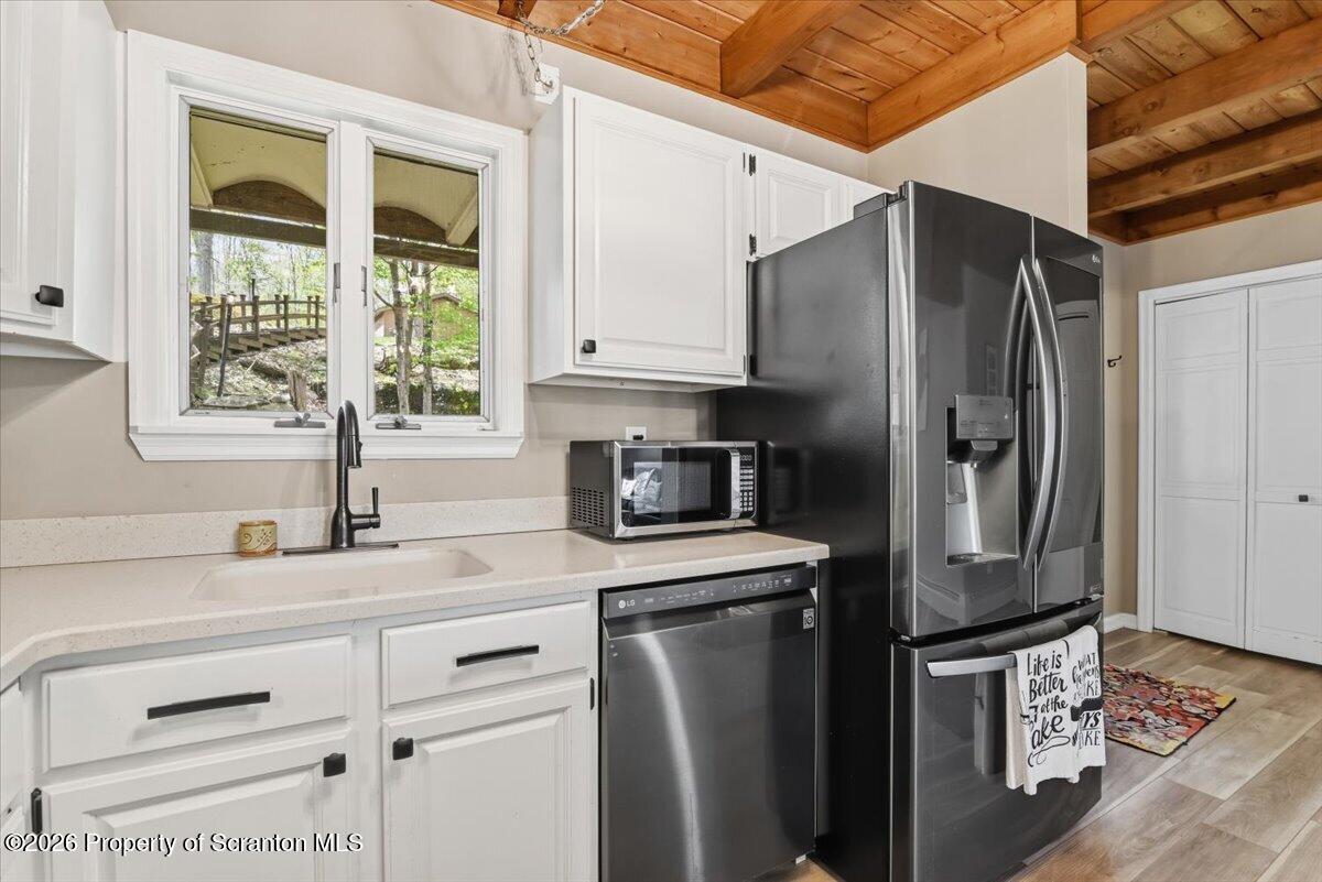 10 Knollwood Road Lake Ariel, PA 18436 - Photo 12 of 60 a kitchen with stainless steel appliances granite countertop a refrigerator and a sink