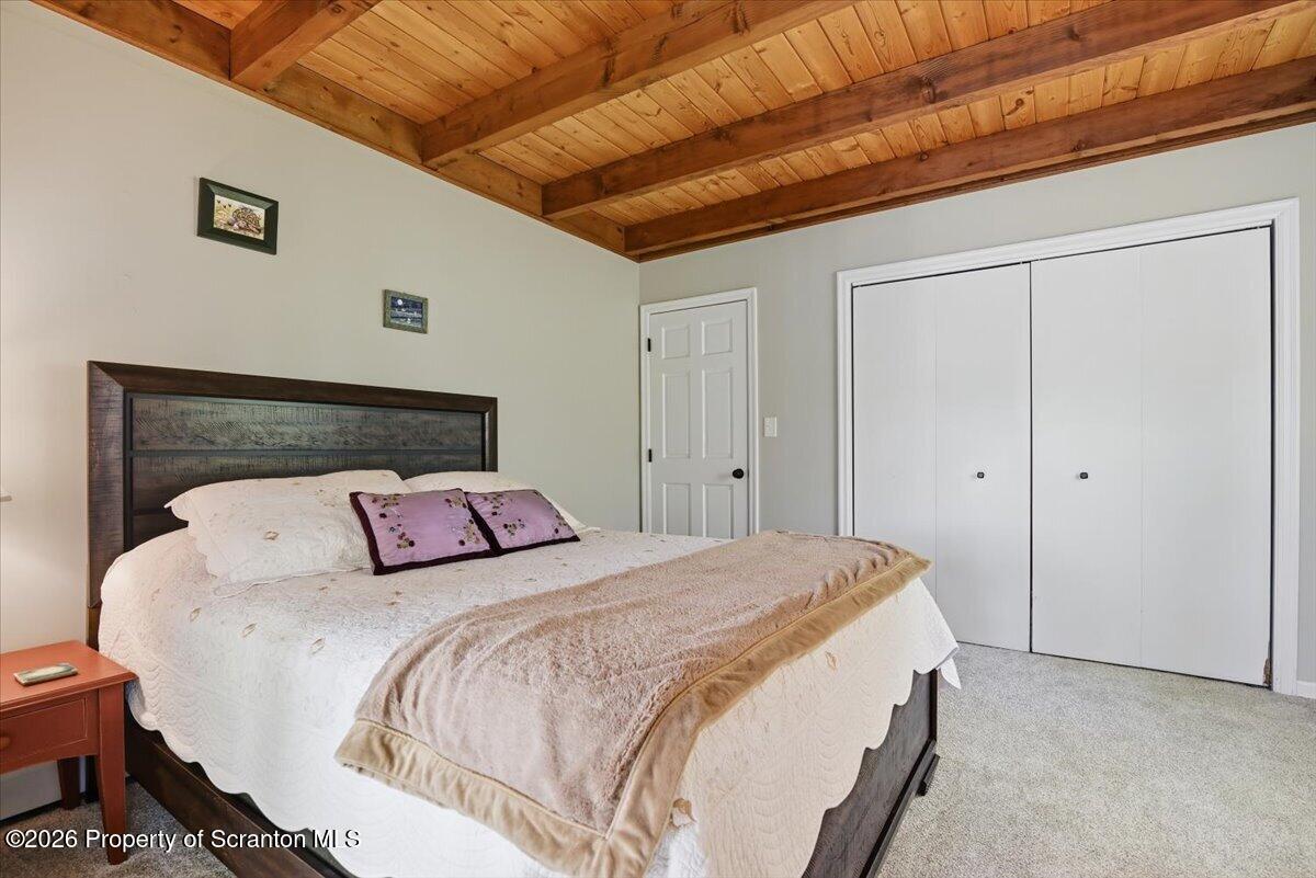 10 Knollwood Road Lake Ariel, PA 18436 - Photo 20 of 60 a bedroom with a bed and a dresser