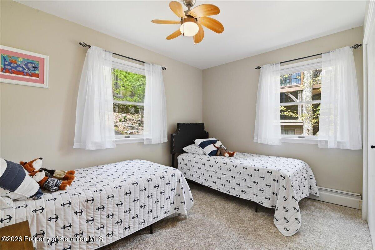 10 Knollwood Road Lake Ariel, PA 18436 - Photo 21 of 60 a bedroom with two beds and a window