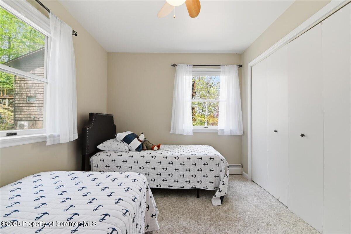 10 Knollwood Road Lake Ariel, PA 18436 - Photo 22 of 60 a bedroom with a bed and a window