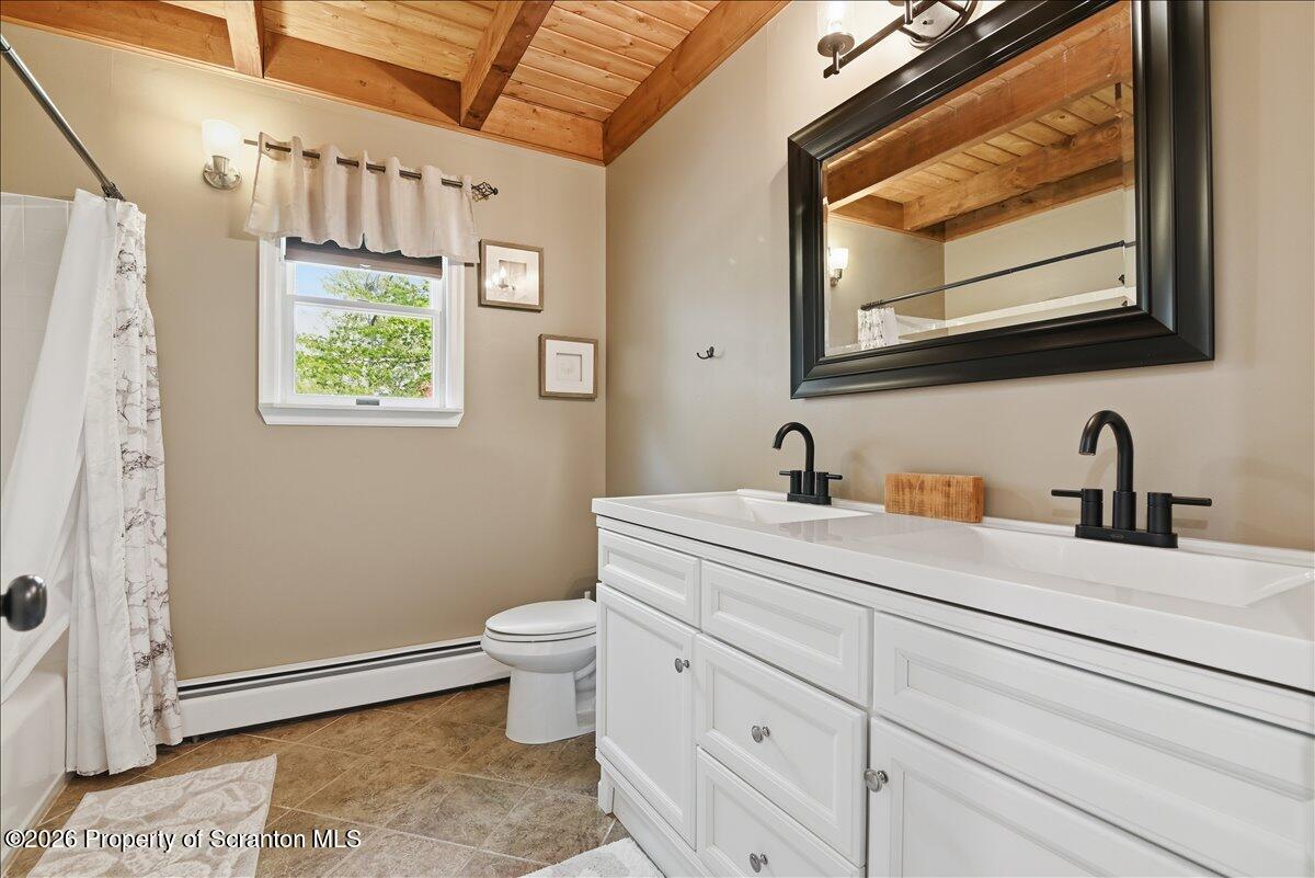 10 Knollwood Road Lake Ariel, PA 18436 - Photo 23 of 60 a bathroom with a toilet sink and mirror