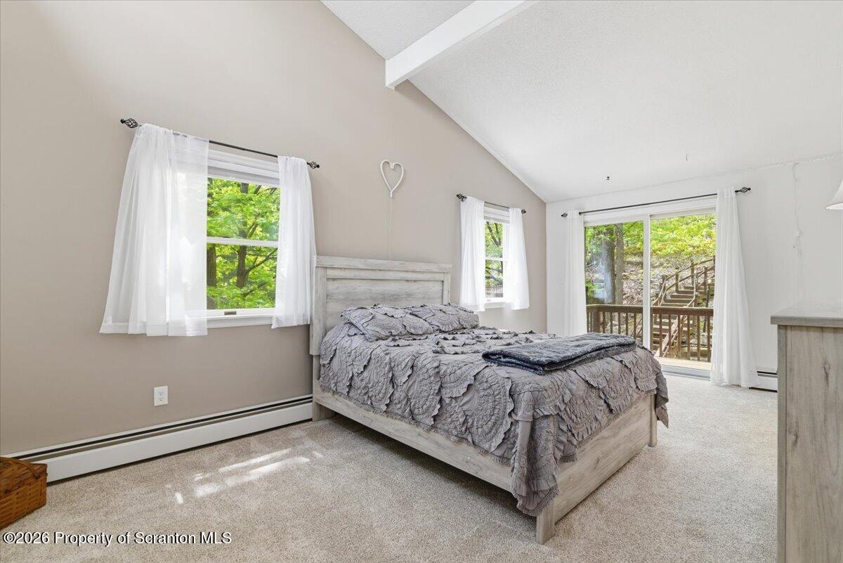 10 Knollwood Road Lake Ariel, PA 18436 - Photo 26 of 60 a bed sitting in a spacious bedroom next to a window
