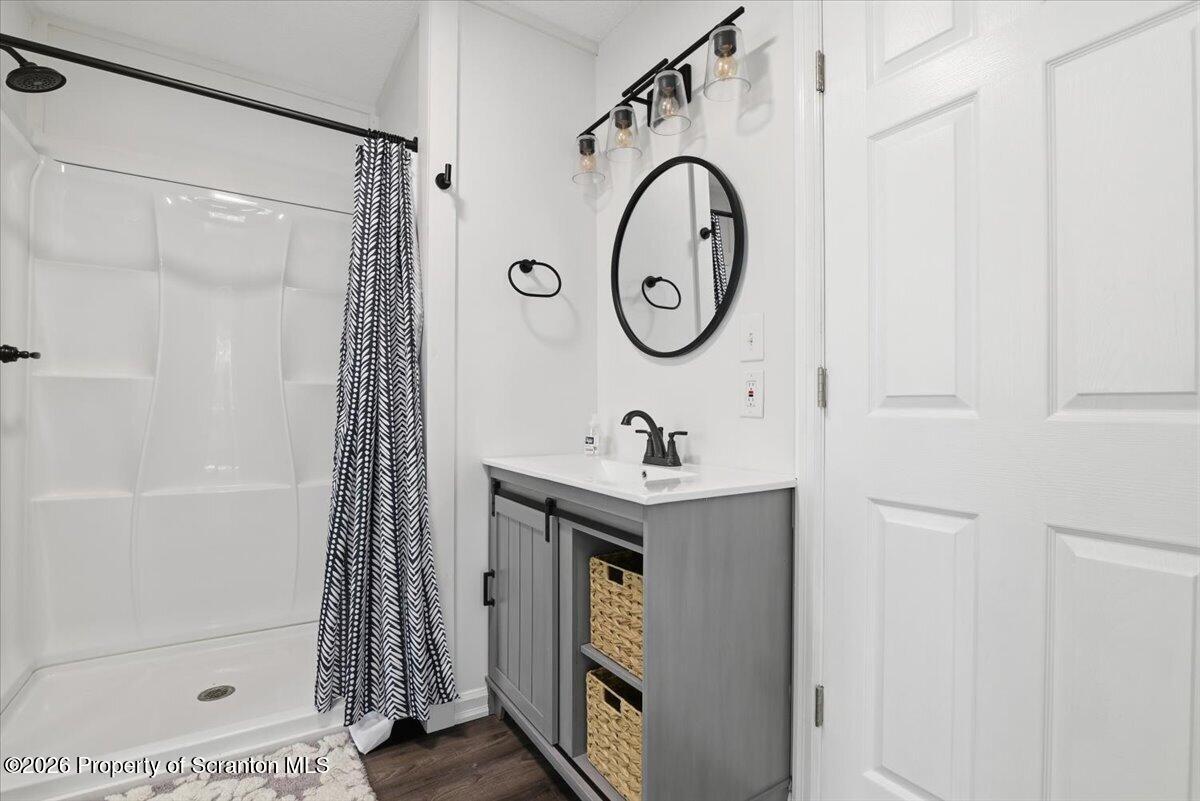 10 Knollwood Road Lake Ariel, PA 18436 - Photo 28 of 60 a bathroom with a sink a toilet and a shower