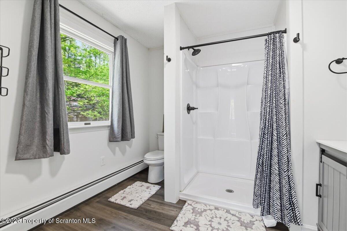 10 Knollwood Road Lake Ariel, PA 18436 - Photo 29 of 60 a bathroom with a shower and a toilet