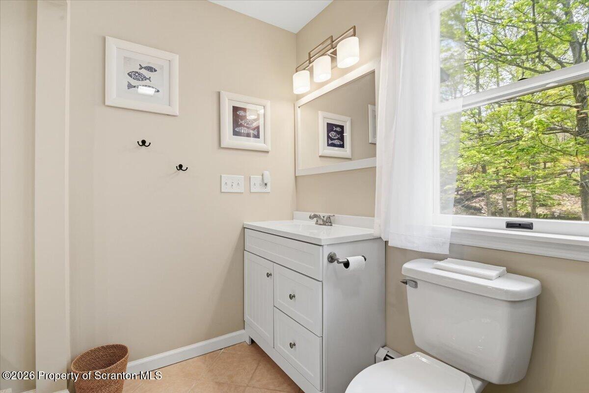 10 Knollwood Road Lake Ariel, PA 18436 - Photo 32 of 60 a spacious bathroom with a toilet sink and a window