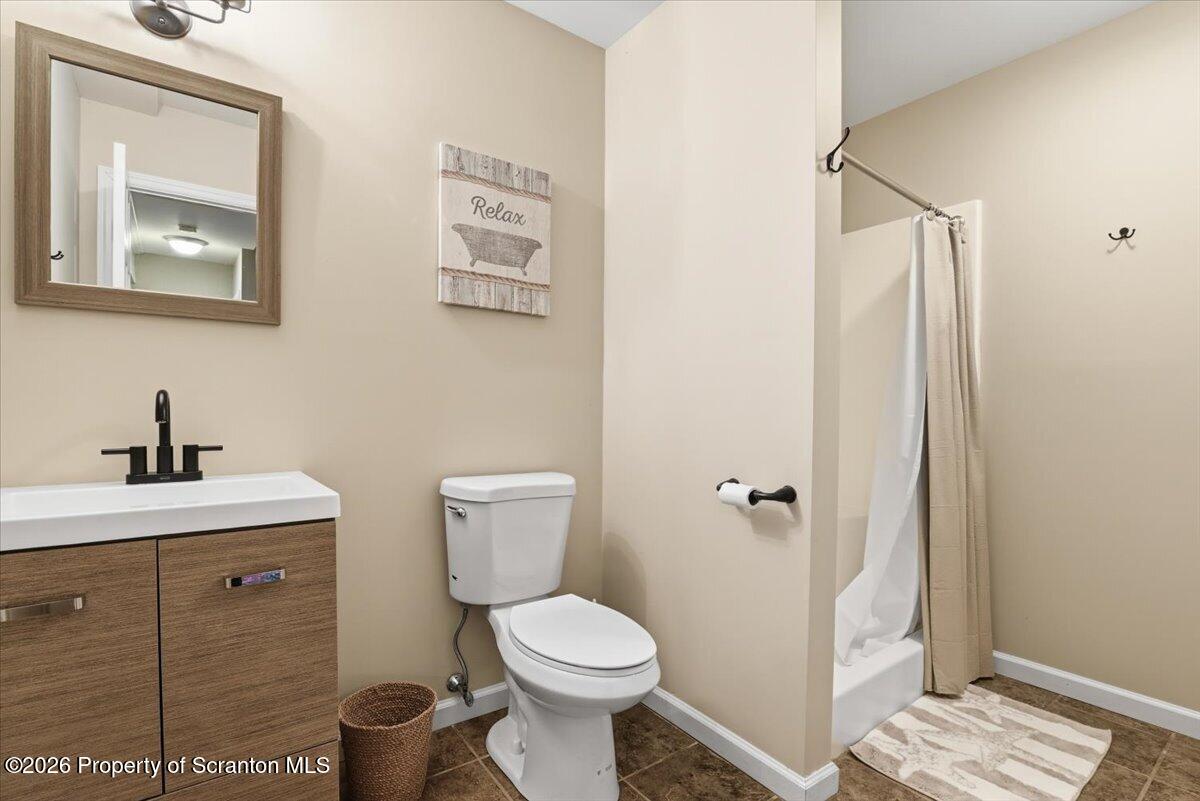 10 Knollwood Road Lake Ariel, PA 18436 - Photo 45 of 60 a bathroom with a toilet a sink and mirror