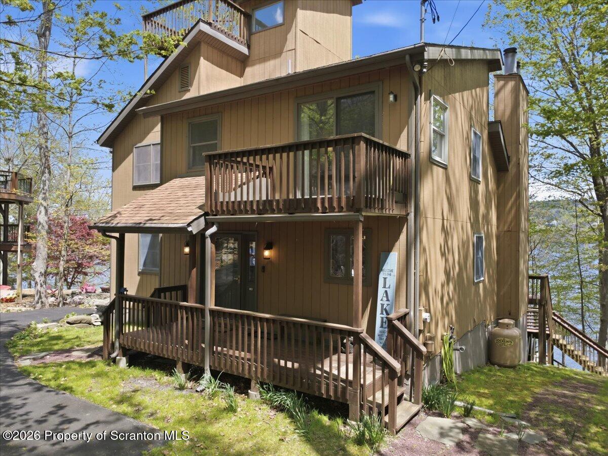 10 Knollwood Road Lake Ariel, PA 18436 - Photo 5 of 60 a view of a small house with wooden fence