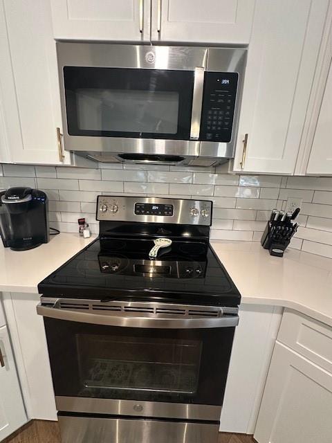 3156 Sweetbriar Drive Villa Rica, GA 30180 - Photo 24 of 39 a stove top oven sitting inside of a kitchen