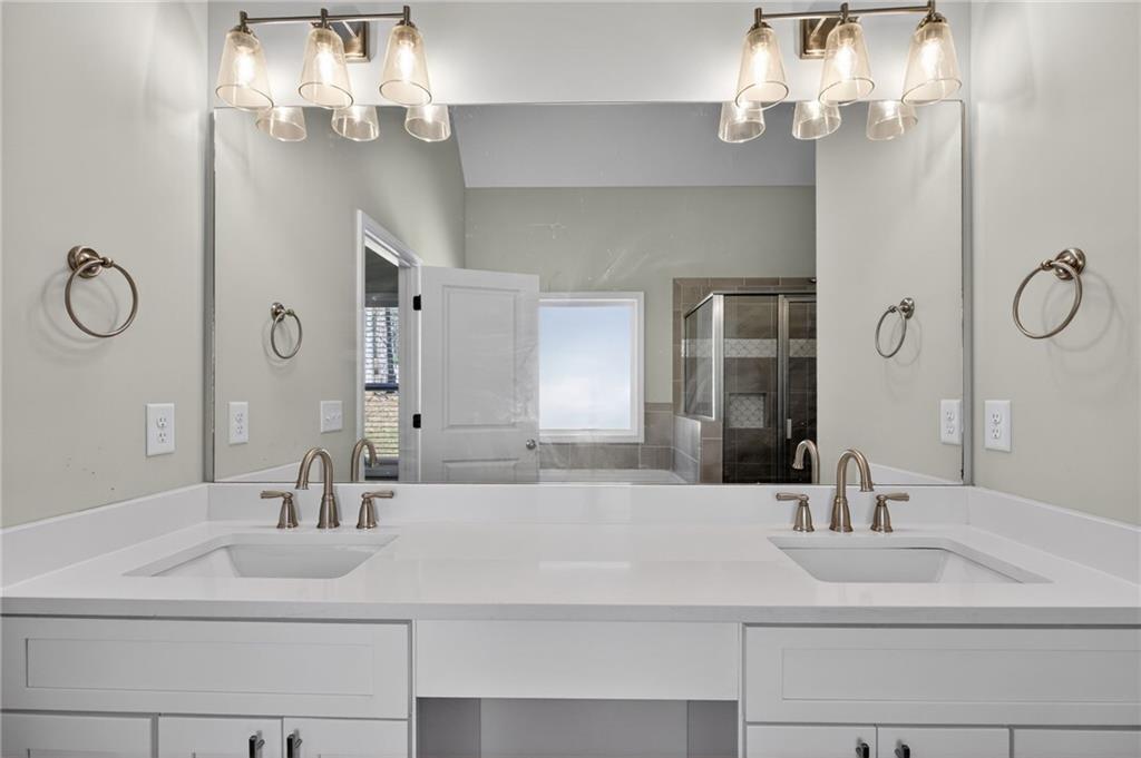 3156 Sweetbriar Drive Villa Rica, GA 30180 - Photo 26 of 45 a bathroom with a sink and a mirror