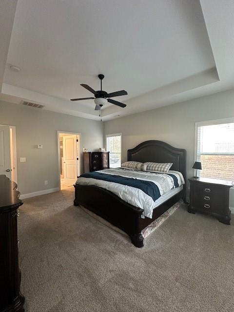 3156 Sweetbriar Drive Villa Rica, GA 30180 - Photo 27 of 39 a spacious bedroom with a bed and a chandelier
