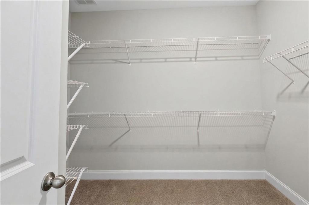 3156 Sweetbriar Drive Villa Rica, GA 30180 - Photo 29 of 45 a view of a room with racks on the wall