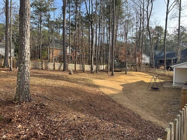 3156 Sweetbriar Drive Villa Rica, GA 30180 - Photo 37 of 39 a swimming pool with trees in the background