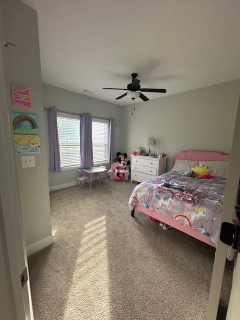 3156 Sweetbriar Drive Villa Rica, GA 30180 - Photo 10 of 39 a bedroom with a bed and a chandelier