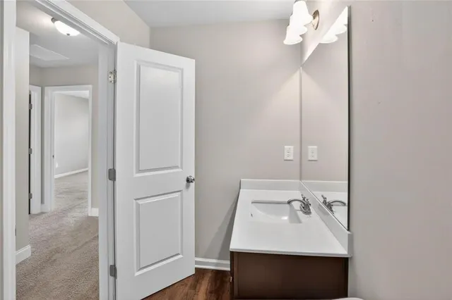a bathroom with a sink vanity and a mirror