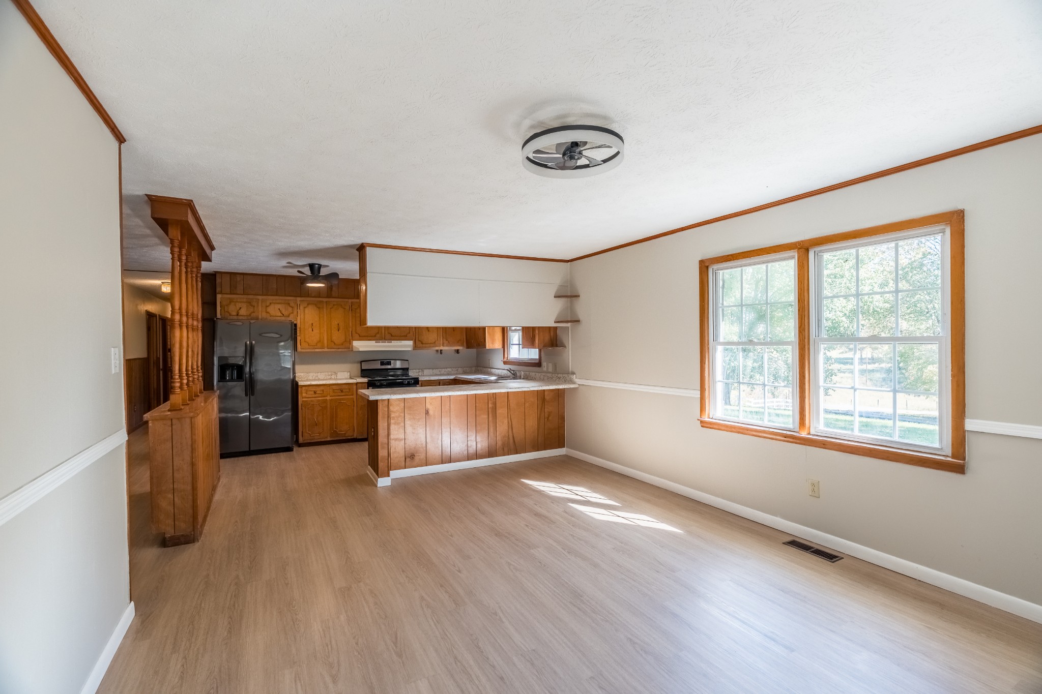 12748 Fruit Hill Red Bridge Road Crofton, KY 42217 - Photo 19 of 29 a kitchen with granite countertop a refrigerator and wooden floor