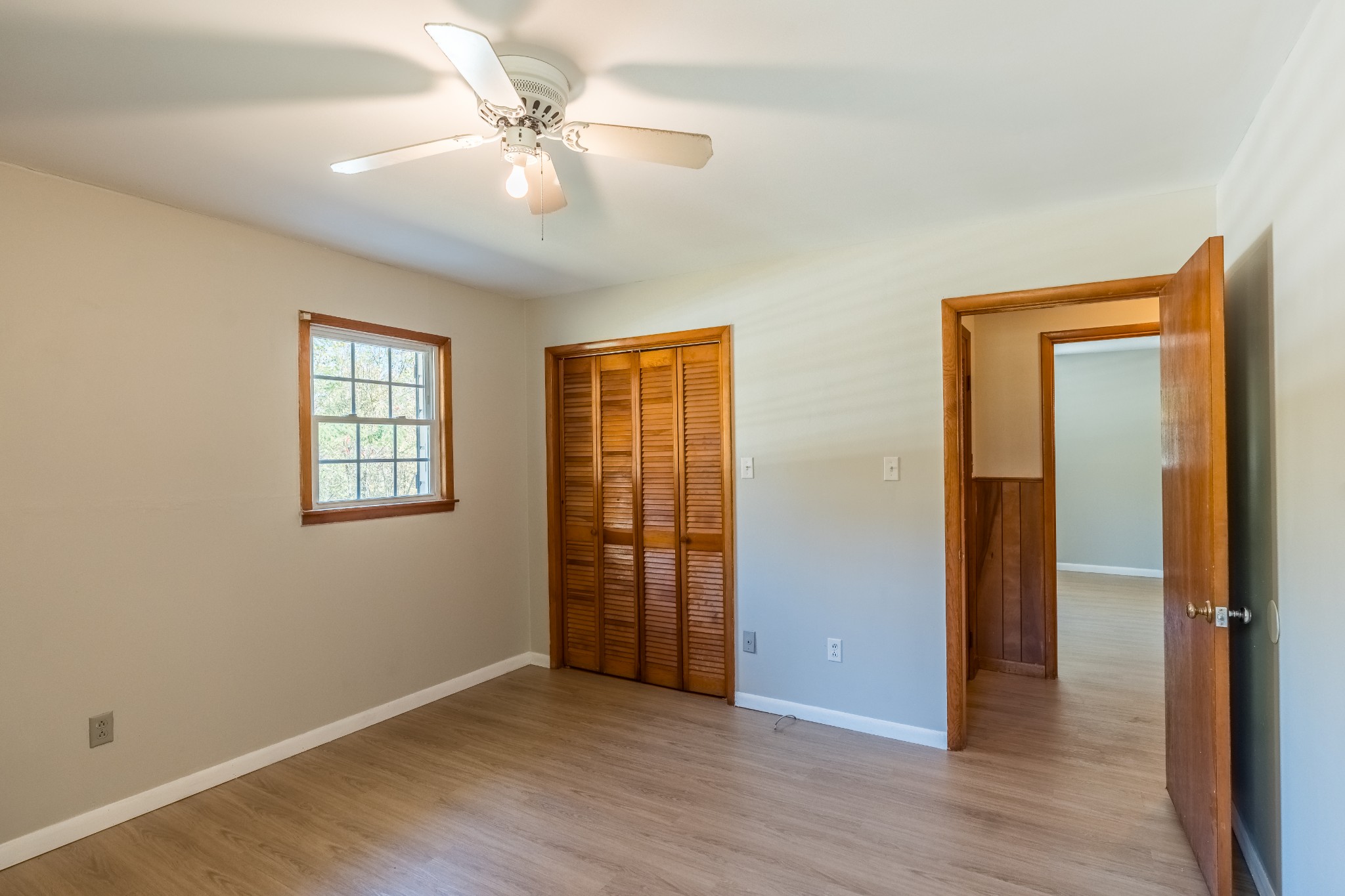 12748 Fruit Hill Red Bridge Road Crofton, KY 42217 - Photo 29 of 29 a view of an empty room with window and wooden floor