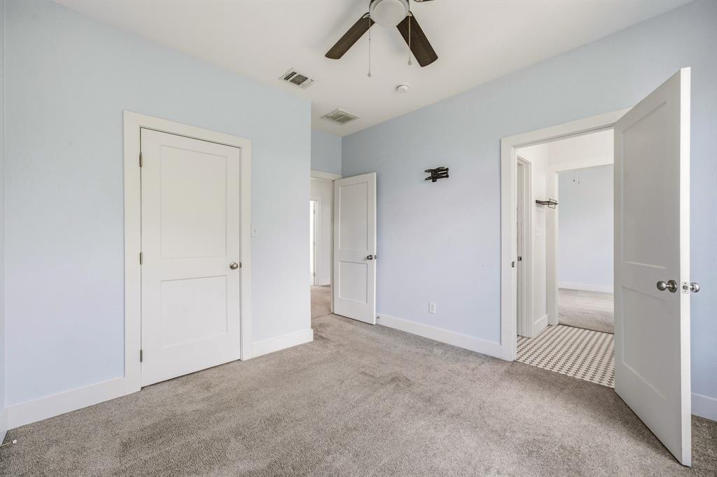 745 North Miller Avenue Stephenville, TX 76401 - Photo 23 of 31 Room featuring light blue walls and gray carpet flooring