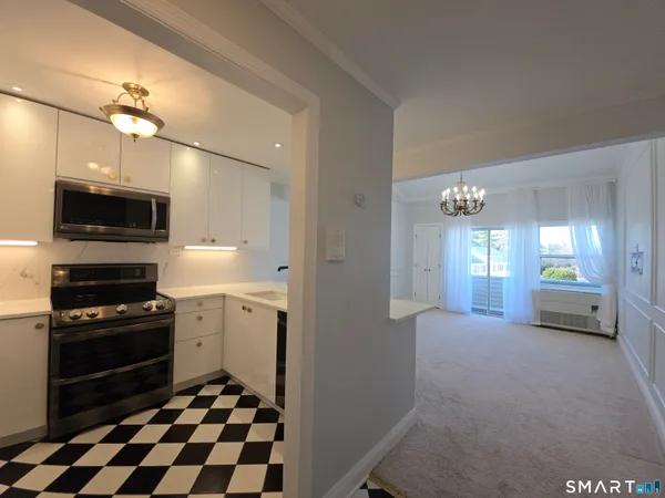 a room with a black white checkered floor and a white checkered floor