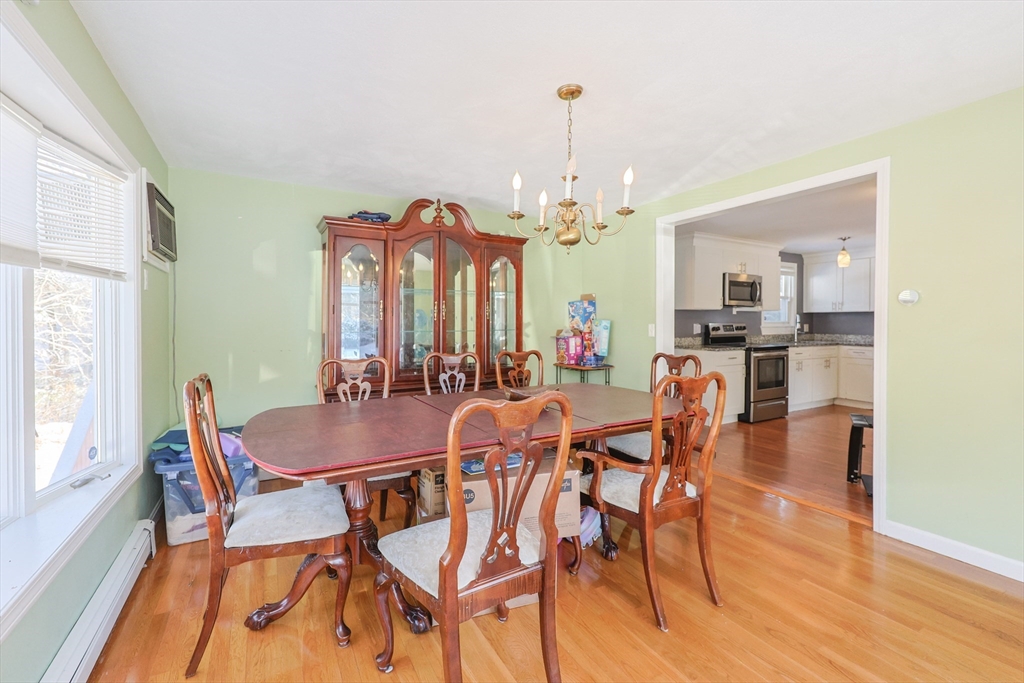 128 Salem Road Billerica, MA 01821 - Photo 14 of 42 a view of a dining room with furniture and wooden floor