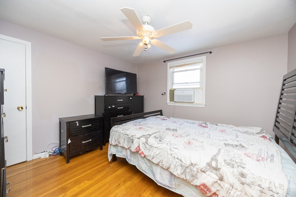 128 Salem Road Billerica, MA 01821 - Photo 15 of 42 a bedroom with a bed and a television