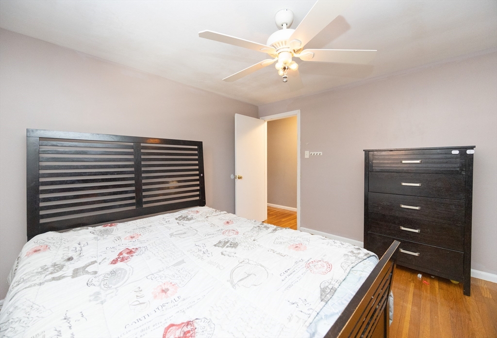 128 Salem Road Billerica, MA 01821 - Photo 19 of 42 a bedroom with a bed and a dresser