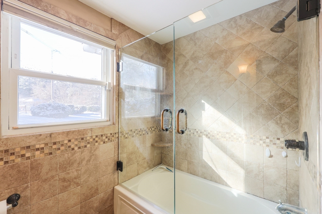 128 Salem Road Billerica, MA 01821 - Photo 22 of 42 a bathroom with a bathtub and a shower