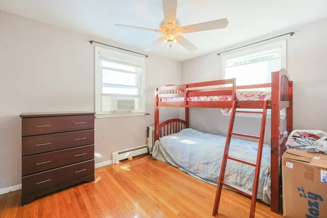 a bedroom with a bed and a dresser