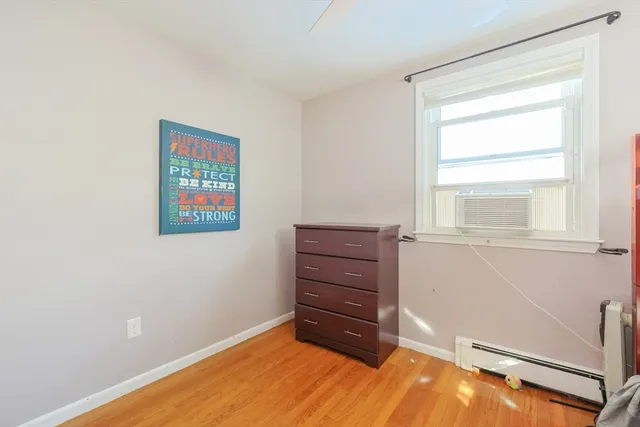 a room with a bed and a window